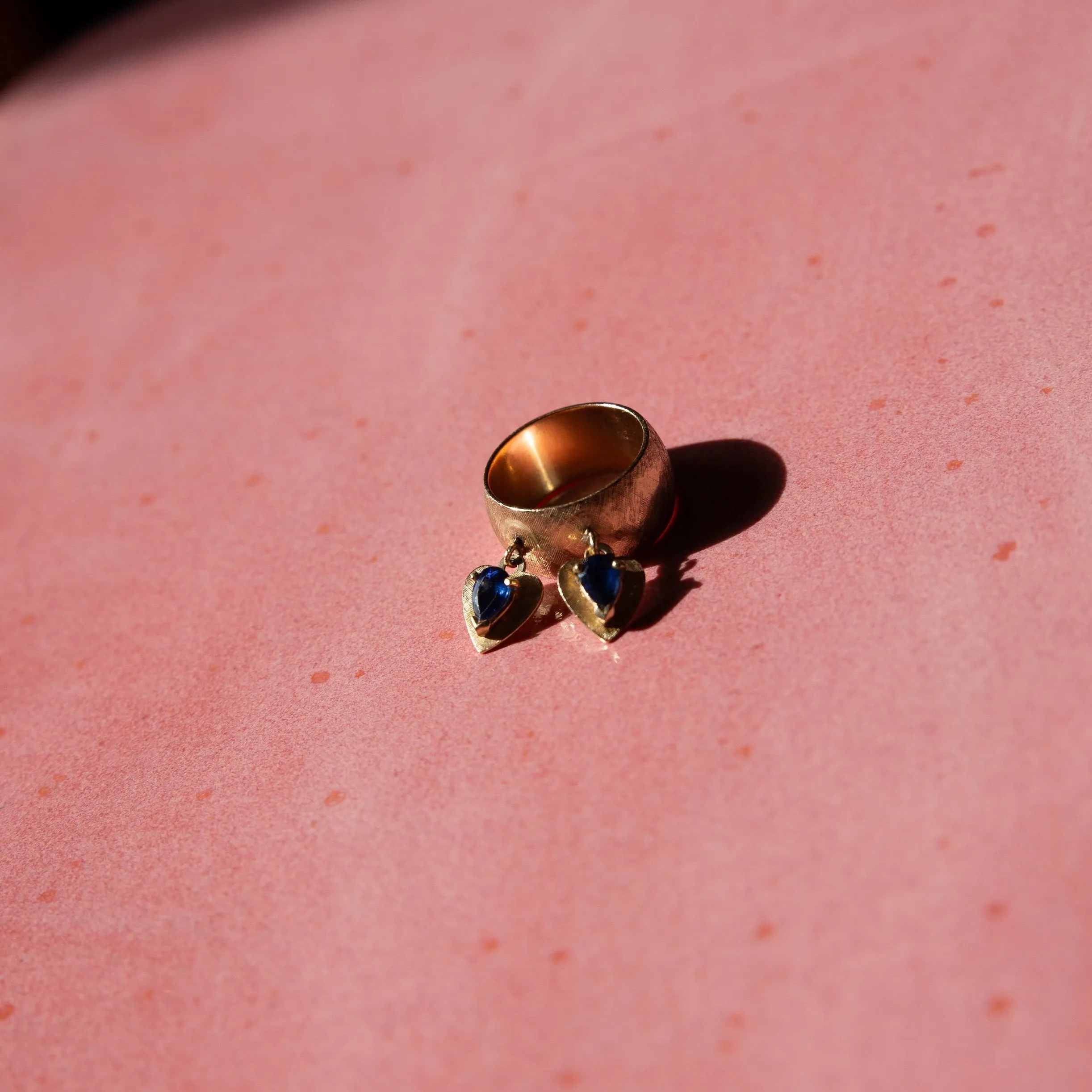 14k Brushed Gold Cigar Band with Dangling Sapphire Hearts