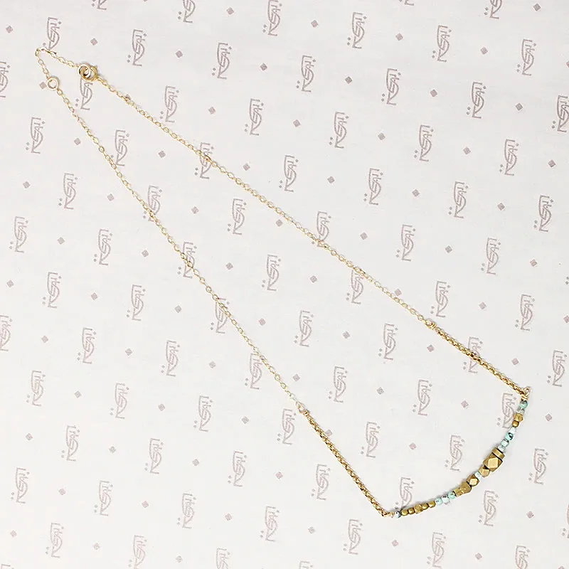 Turquoise & Brass Bead Arc Necklace by Brin