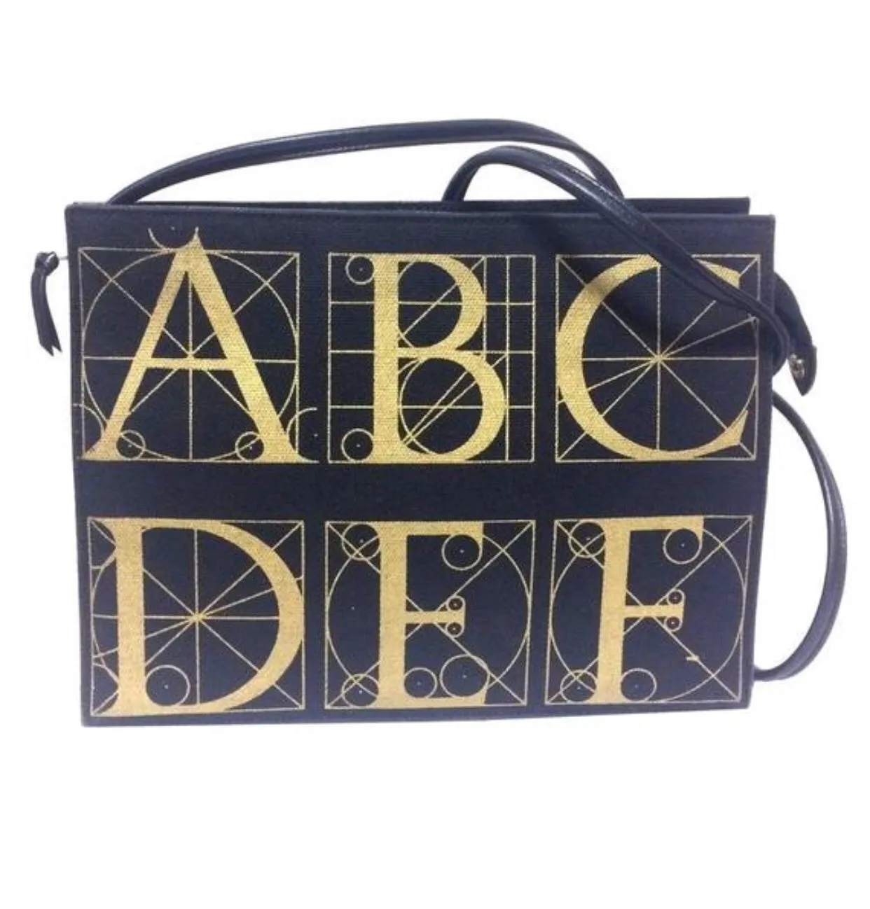 Vintage Paloma Picasso black canvas and leather combo shoulder bag with golden A B C D E F and S T V X Y letter print.