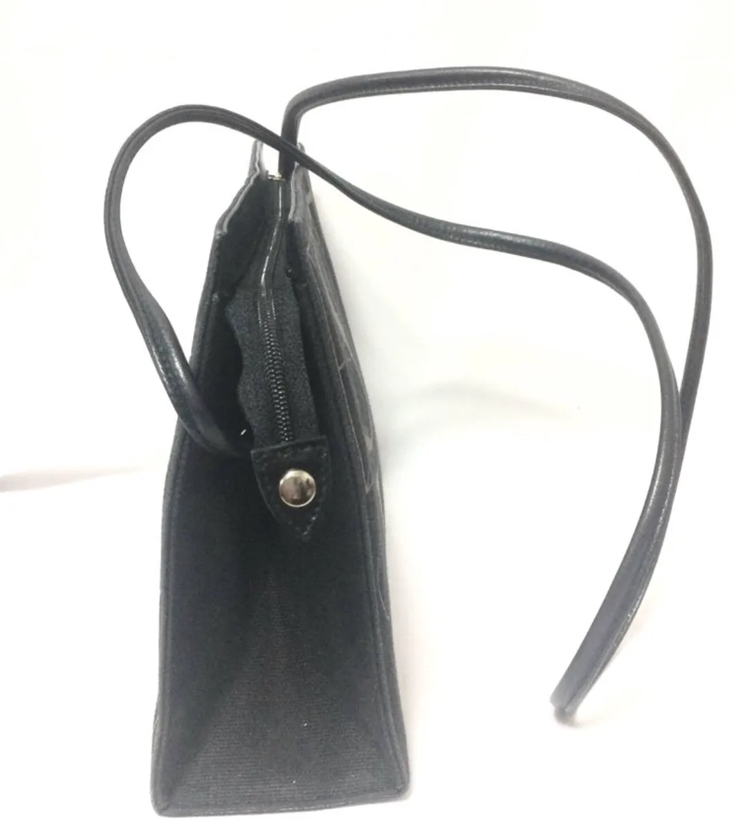 Vintage Paloma Picasso black canvas and leather combo shoulder bag with golden A B C D E F and S T V X Y letter print.
