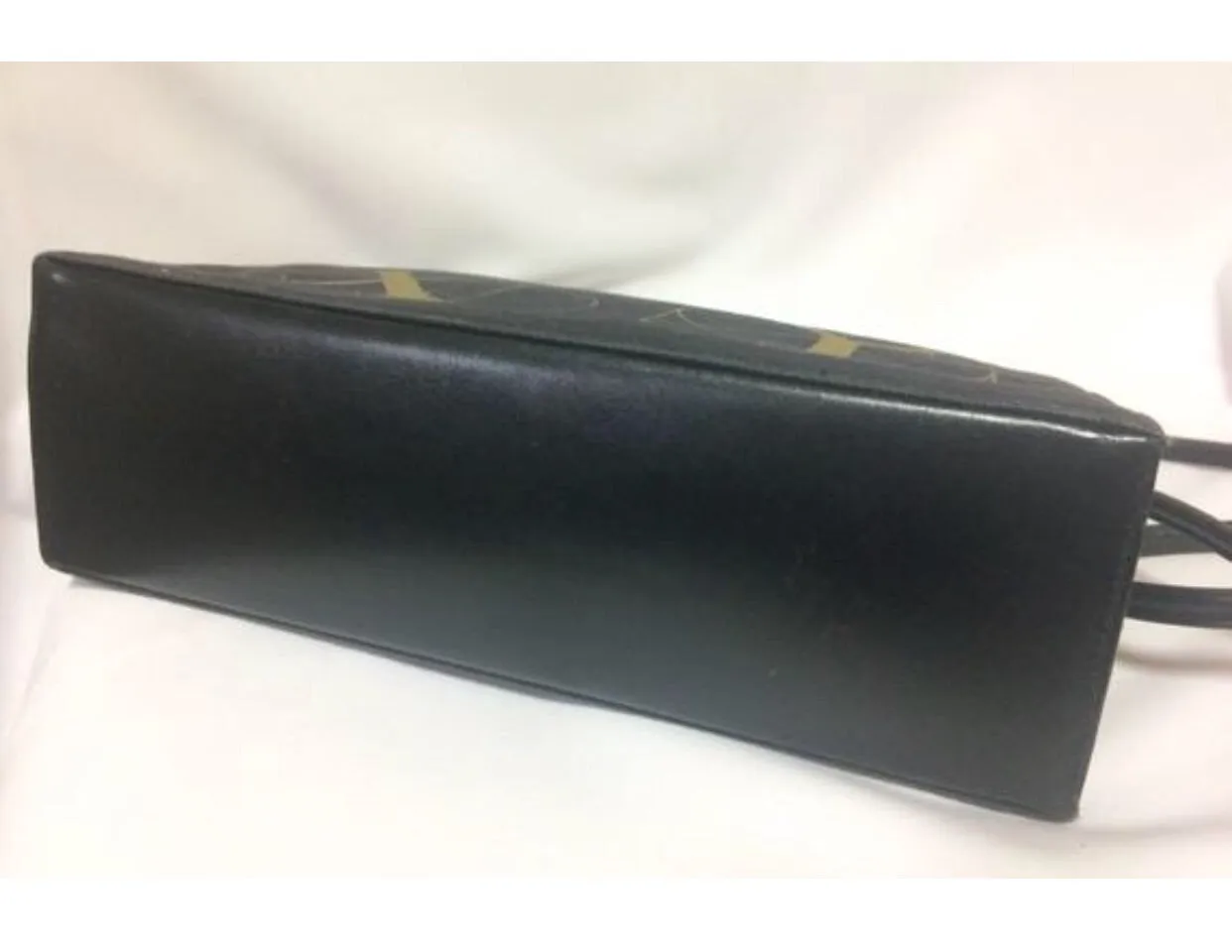 Vintage Paloma Picasso black canvas and leather combo shoulder bag with golden A B C D E F and S T V X Y letter print.